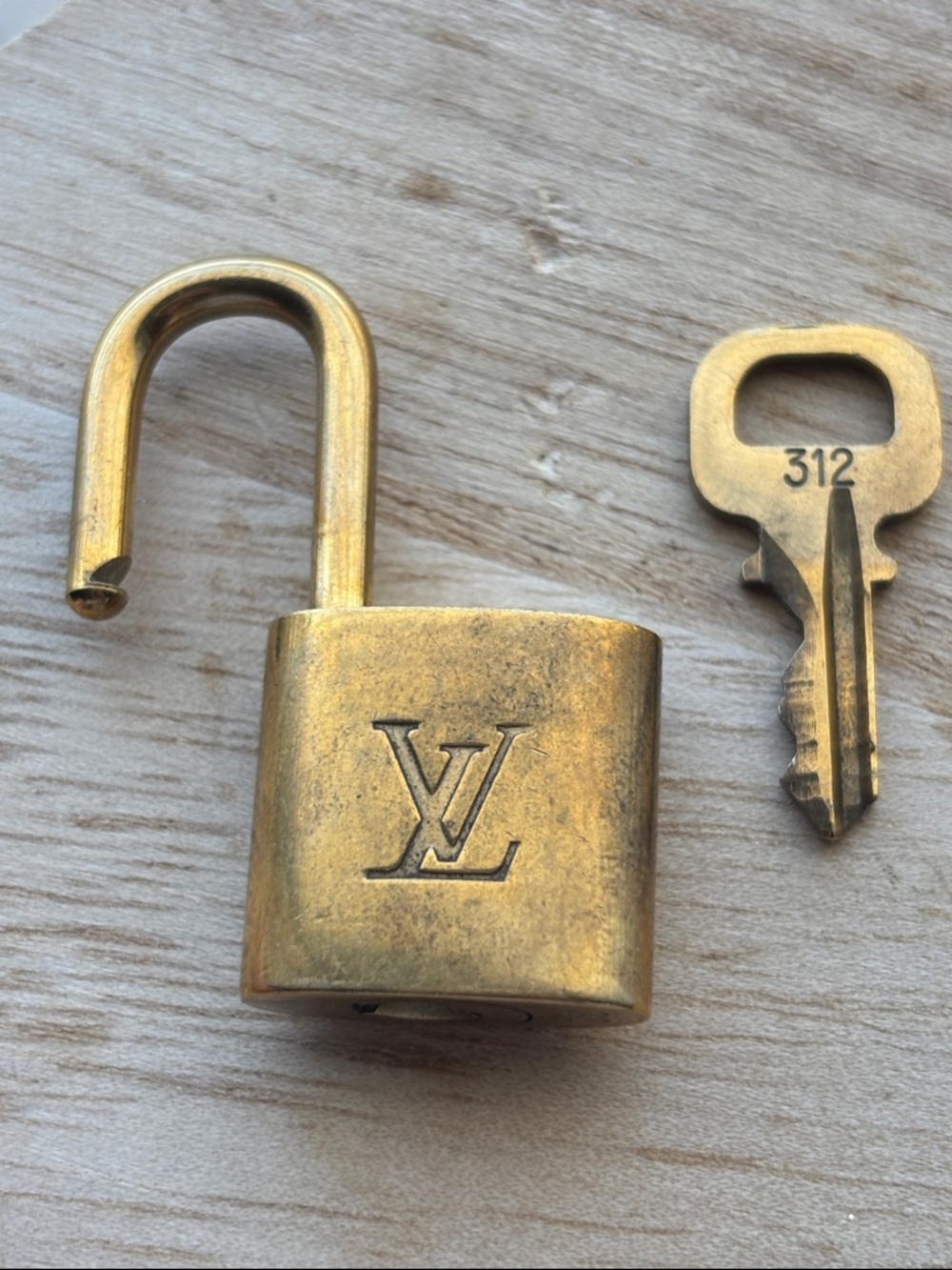 Louis Vuitton Brass-Tone Padlock with Key in Gold